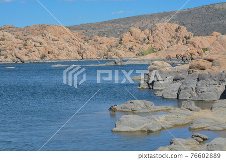 Lake Watson has picturesque, exposed granite bedrock with bright blue water. Located in Prescott, Yavapai County, Arizona  76602889