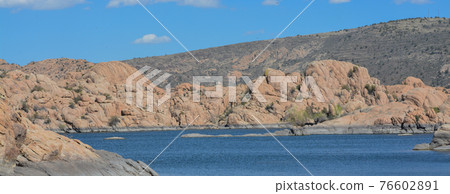 Lake Watson has picturesque, exposed granite bedrock with bright blue water. Located in Prescott, Yavapai County, Arizona  76602891