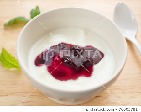 Yogurt with blueberry sauce 76603781