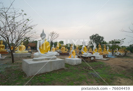 Row of Buddha statues. Old ruins of a temple in Wat Phai Rong Wua temple, Song Phi Nong, Suphan Buri. Famous tourist attraction landmark. Thai History architecture. 76604459