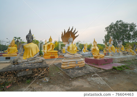 Row of Buddha statues. Old ruins of a temple in Wat Phai Rong Wua temple, Song Phi Nong, Suphan Buri. Famous tourist attraction landmark. Thai History architecture. Row of Buddha statues. Old ruins of a temple in Wat Phai Rong Wua temple, Song Phi Nong, Suphan Buri. Famous tourist attraction landmark. Thai History architecture. 76604463