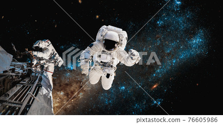 Astronaut spaceman do spacewalk while working for space station 76605986