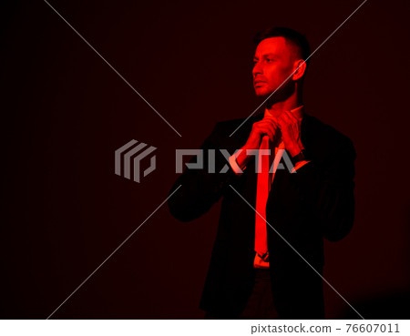Young self-confident businessman in official suit 76607011