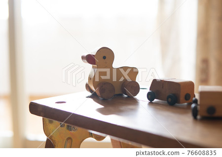 Chick wooden toys by the window Chick wooden toys by the window 76608835