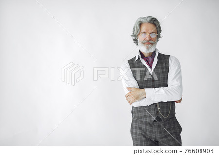 Handsome pensive mature businessman in formal suit 76608903
