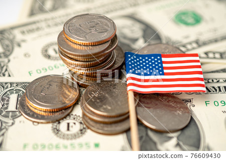 Stack of coins with USA America flag on dollar banknotes. 76609430