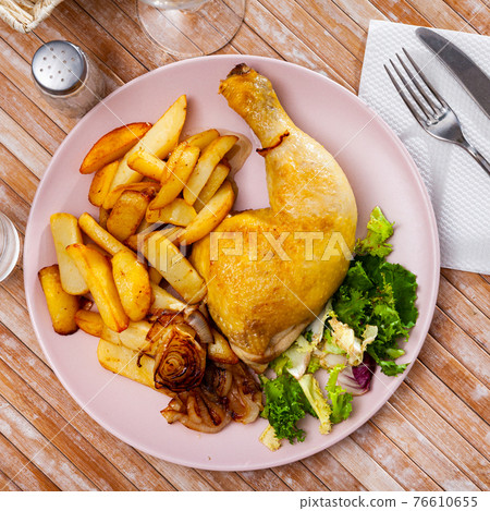 Baked chicken legs with potatoes 76610655