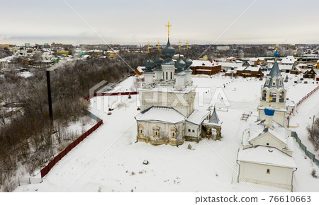 View from drone of Murom Resurrection convent on winter day, Russia 76610663