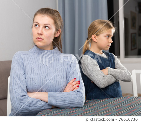 Woman and daughter offended at each other 76610730