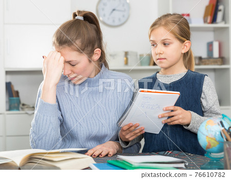 Woman dissatisfied with her daughter Woman dissatisfied with her daughter 76610782