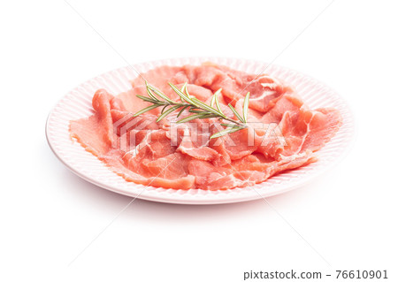 Sliced carpaccio. Raw beef meat on plate. 76610901