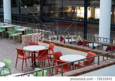 Interior of wooden table in food court shopping mall. 76610942