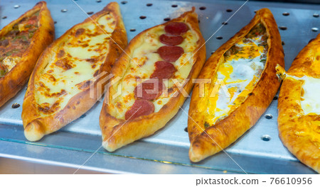 Assorted Turkish foodset. Pide with mea pide with cheese, pide mix 76610956