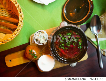 Red borscht with pampushky, minced salo, garlic, greens and smetana 76611145