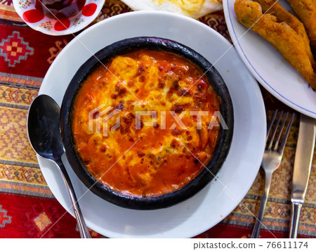 Delicious traditional dish cooked in a pot, which is called Saute in Turkish Delicious traditional dish cooked in a pot, which is called Saute in Turkish 76611174