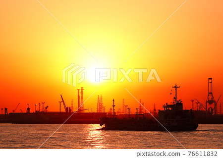 Large ship at dusk yellow 76611832