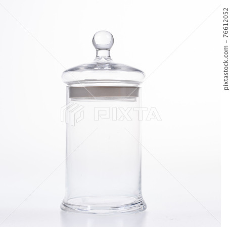 Glass jar with lid on white background 76612052