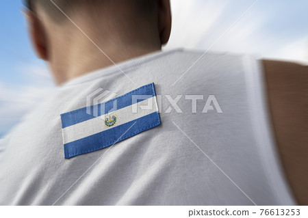 The national flag of Salvador on the athlete's back The national flag of Salvador on the athlete's back 76613253