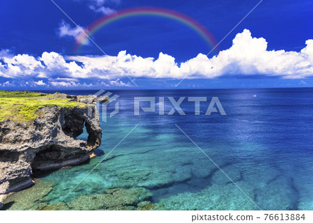 Beautiful coral reef sea and rainbow in Manzamo 76613884