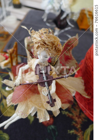 Fairies playing musical instruments 76616615