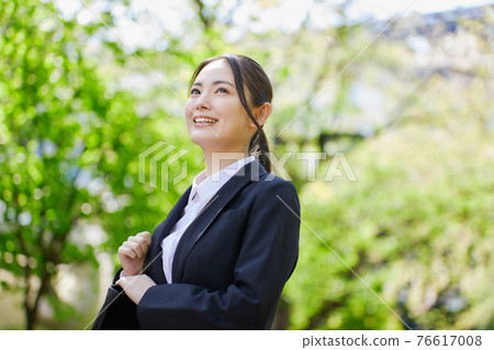 Young lady in recruit suit 76617008