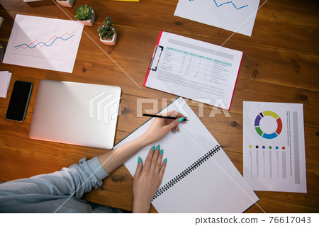 Close up manager working in modern office using devices and gadgets during creative meeting 76617043