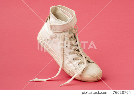 White shoe on the pink background White shoe on the pink background 76618704