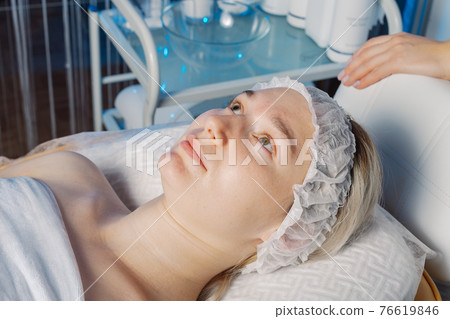 Beautiful woman before a cosmetic procedure in a Beautiful woman before a cosmetic procedure in a 76619846