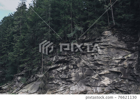stormy crystal clear river in the rocky Carpathian mountains 76621130