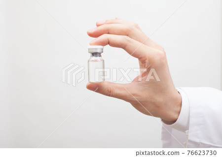 Glass bottle with vaccine 76623730