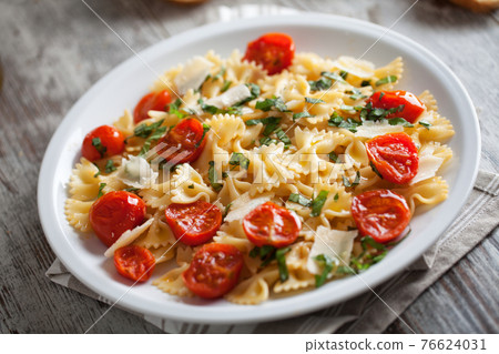 Pasta with fresh tomatoes and basil. High quality photo Pasta with fresh tomatoes and basil. High quality photo 76624031