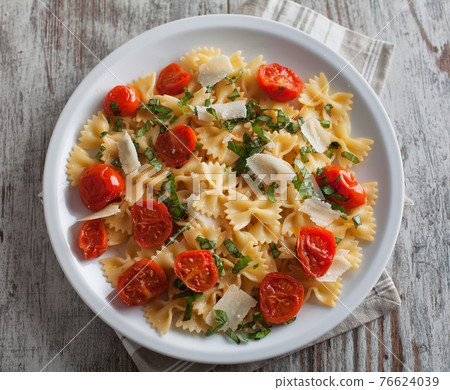 Pasta with fresh tomatoes and basil. High quality photo 76624039