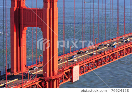 Close-up of vehicles, traffic and bridge towers on the Golden Gate Bridge in San Francisco, California, USA Close-up of vehicles, traffic and bridge towers on the Golden Gate Bridge in San Francisco, California, USA 76624138