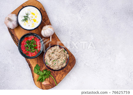 Baba ganoush, tzatziki and tomato ezme 76625759