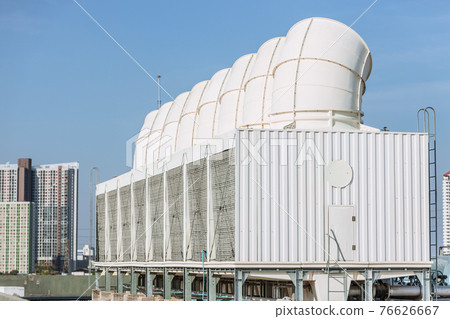 Row of large Air cooling tower or HVAC chilling units at building roof. 76626667