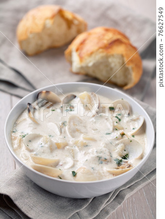 Creamy Clam Chowder on a plate. High quality photo. Creamy Clam Chowder on a plate. High quality photo. 76627549