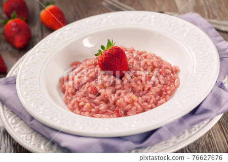 Risotto With Strawberries on a plate. High quality photo. 76627676