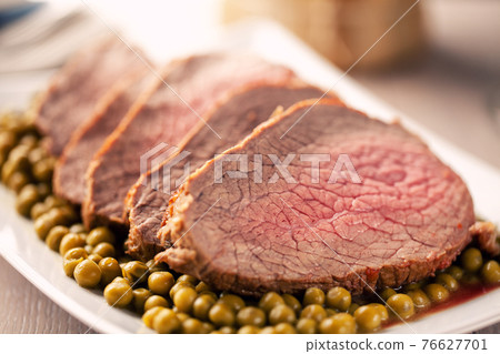 Roast Beef With Peas on a plate. High quality photo. Roast Beef With Peas on a plate. High quality photo. 76627701