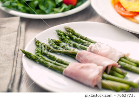 Ham rolls with asparagus. High quality photo. 76627733