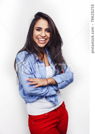 young happy smiling latin american teenage girl emotional posing on white background, lifestyle people concept 76628258