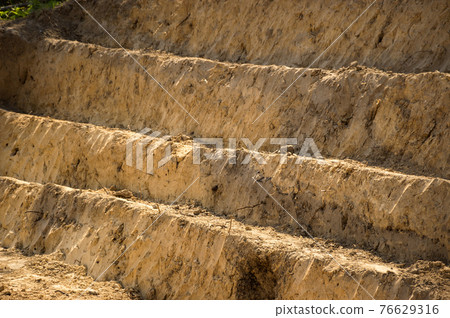 Earth dug by steps 76629316