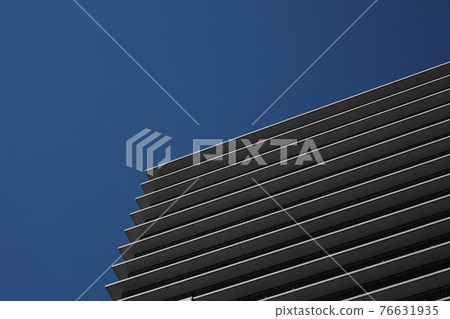 A beautiful high-rise building with a striped pattern on the outer wall of the floor boundary A beautiful high-rise building with a striped pattern on the outer wall of the floor boundary 76631935