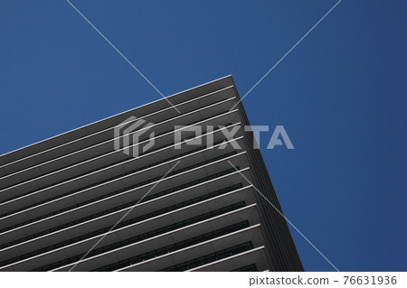 A beautiful high-rise building with a striped pattern on the outer wall of the floor boundary A beautiful high-rise building with a striped pattern on the outer wall of the floor boundary 76631936