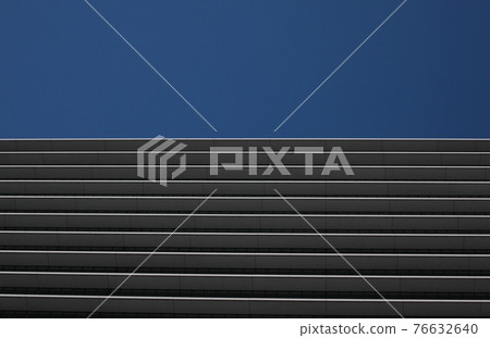 A beautiful high-rise building with a striped pattern on the outer wall of the floor boundary A beautiful high-rise building with a striped pattern on the outer wall of the floor boundary 76632640
