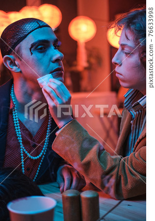 Woman helping her transgender friend Woman helping her transgender friend 76633998