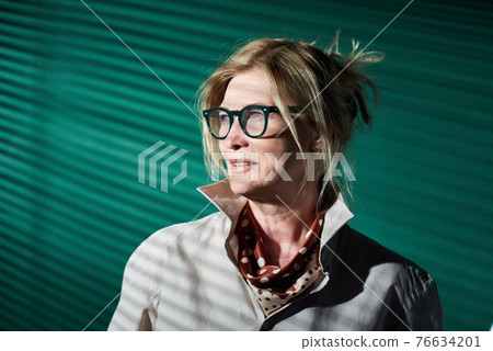 Mature elegant businesswoman at office 76634201