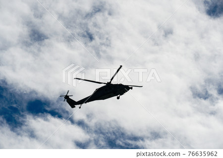 Sheriff Helicopter Hovering on a Beautiful Sky Background 76635962
