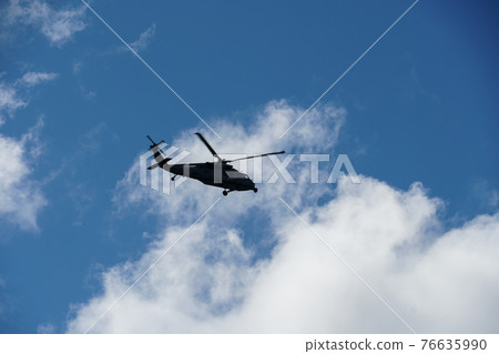 Sheriff Helicopter Hovering on a Beautiful Sky Background 76635990