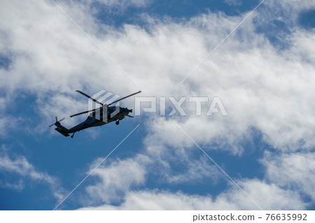 Sheriff Helicopter Hovering on a Beautiful Sky Background 76635992