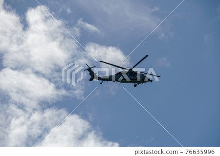 Sheriff Helicopter Hovering on a Beautiful Sky Background 76635996